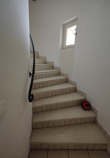 Treppe mit geschmiedetem Handlauf